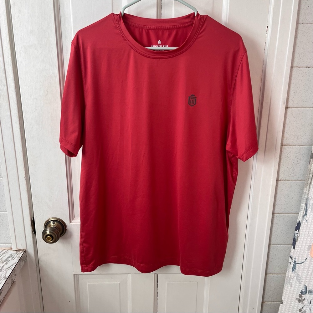 Greatness Wins Men's Red Performance Training Tee with Subtle Shield Logo